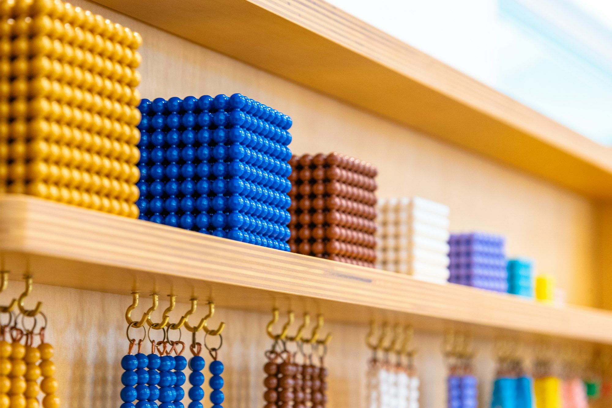 Montessori bead chain lesson for math in Elementary school classroom