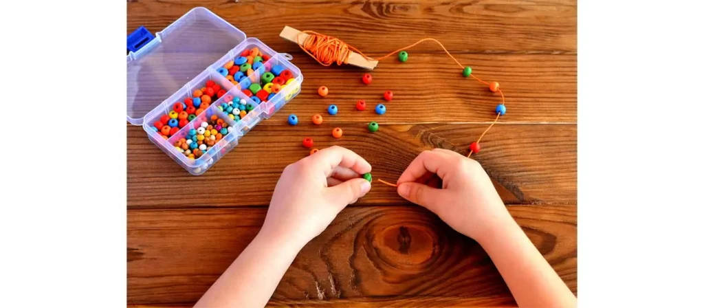 Unlocking Play Schemas: The Essential Guide to Child Development 35 Bead Threading